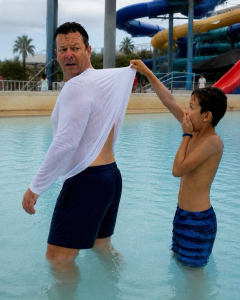 MY HUSBAND OF 22 YEARS REFUSED TO TAKE HIS LONG-SLEEVE SHIRT OFF AT THE WATER PARK – WHEN OUR 9-YEAR-OLD SON YANKED IT UP, I DISCOVERED THE DEVASTATING TRUTH